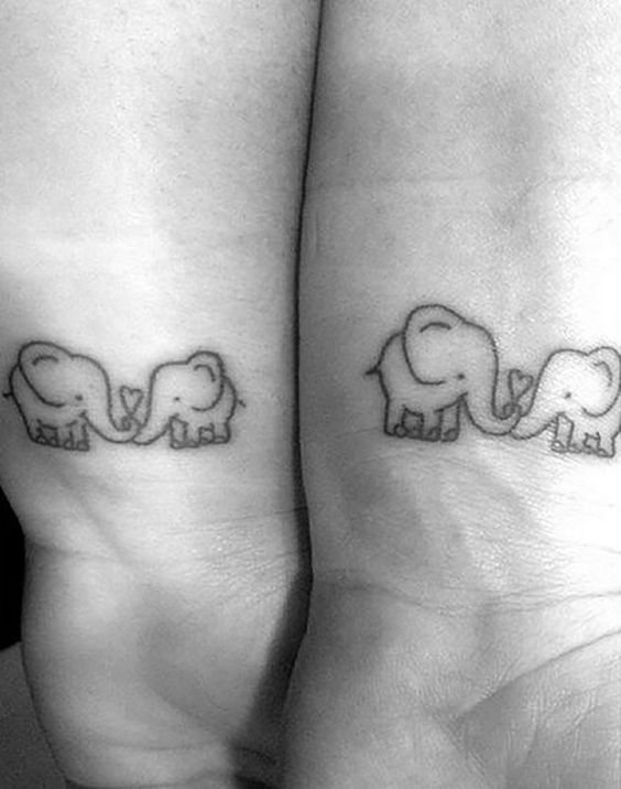 Matching mother and daughter elephant tattoos by Laura Jade TattooNOW