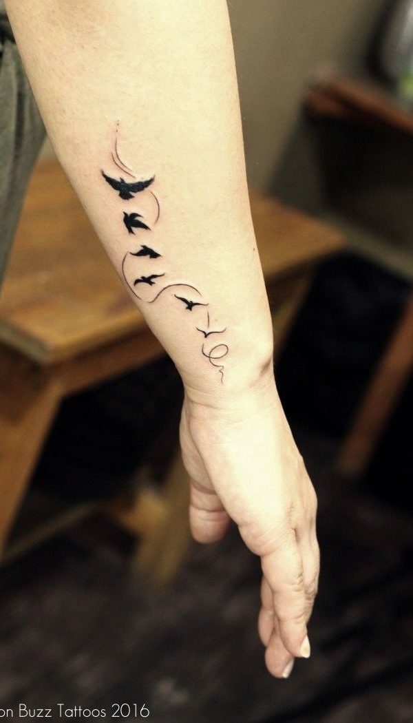 Lightning bolt tattoo on the left arm