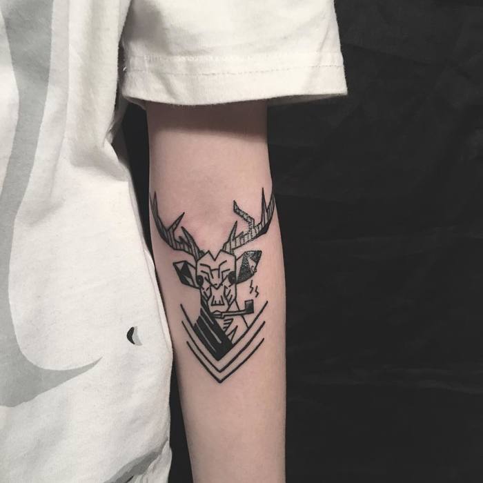 Black Ink Deer Tattoo On Left Arm